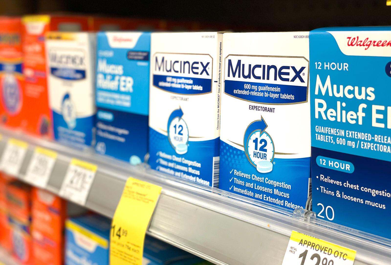 boxes of standard Mucinex medication on store shelves
